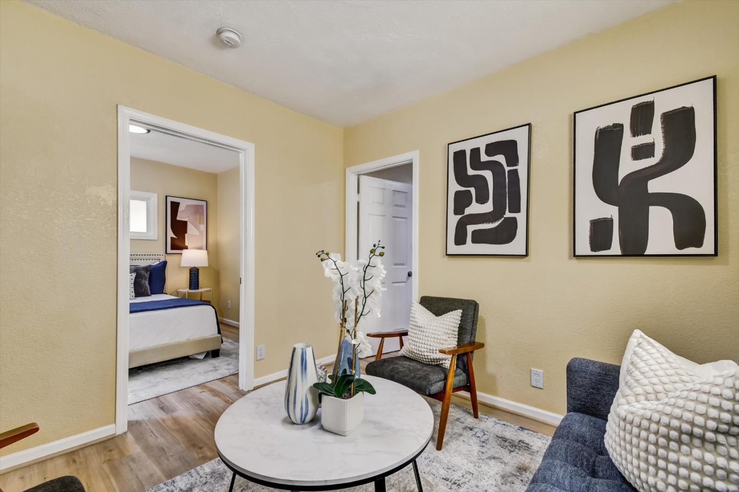 324 Holloway Avenue San Francisco, CA 94112 - Photo 5 of 37 a living room with furniture and painting