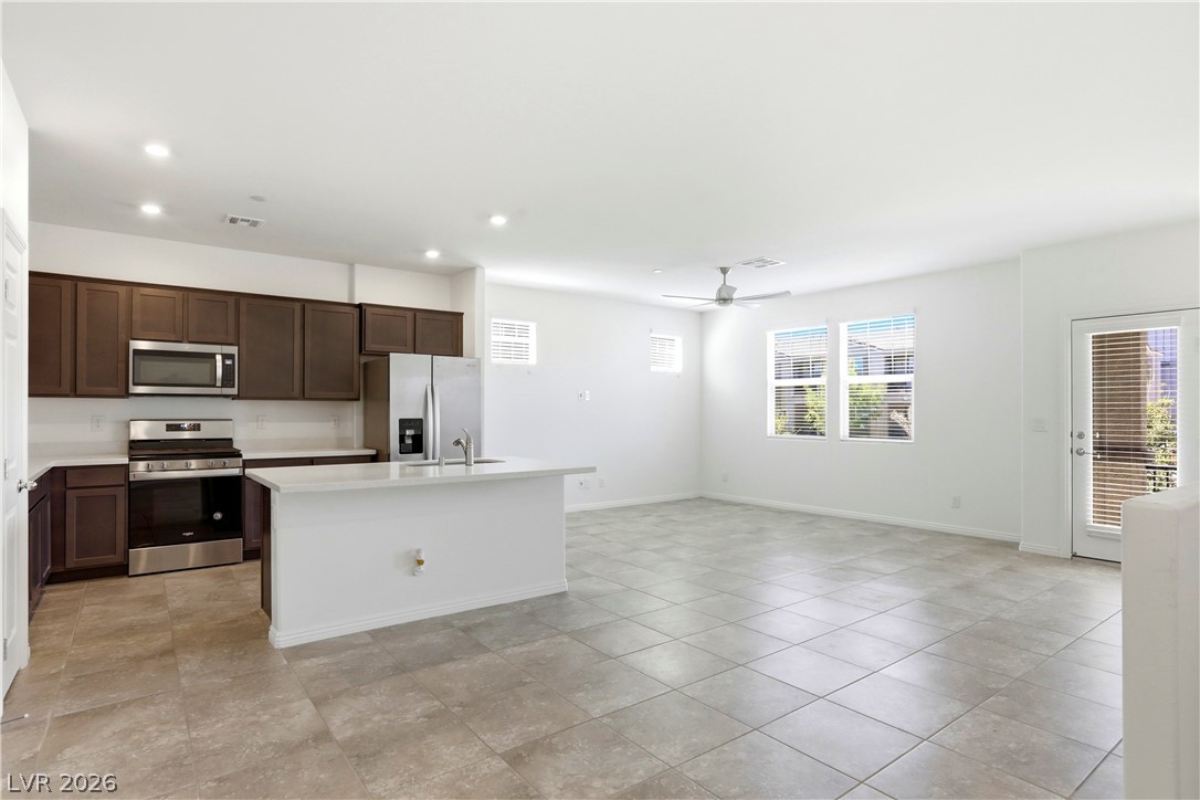 461 Ylang Place Henderson, NV 89015 - Photo 14 of 35 Kitchen & Living Room