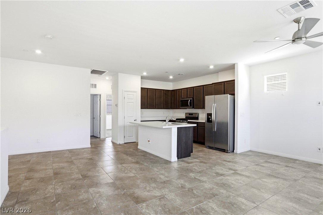 461 Ylang Place Henderson, NV 89015 - Photo 16 of 35 Kitchen, living and dining spaces