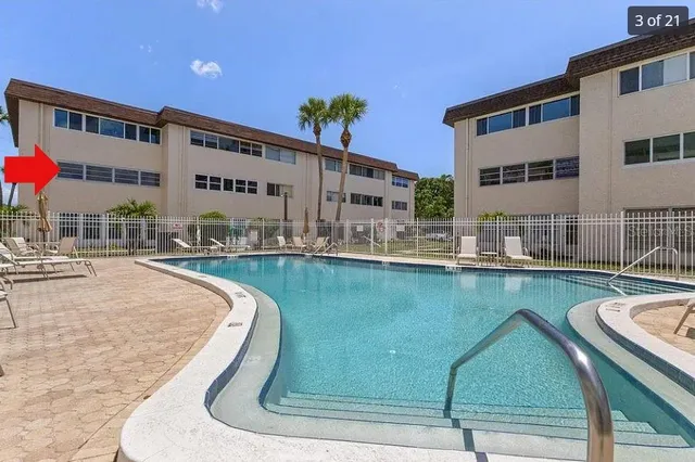 a view of swimming pool with outdoor seating