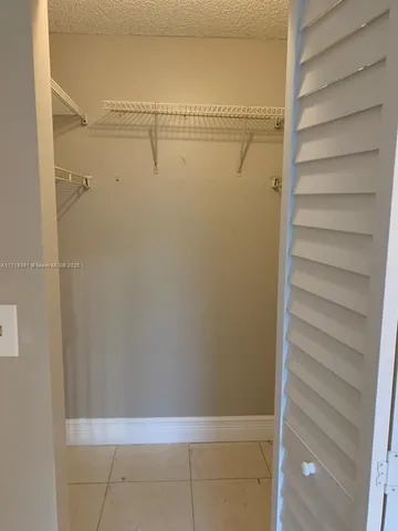 a bathroom with a shower and a mirror