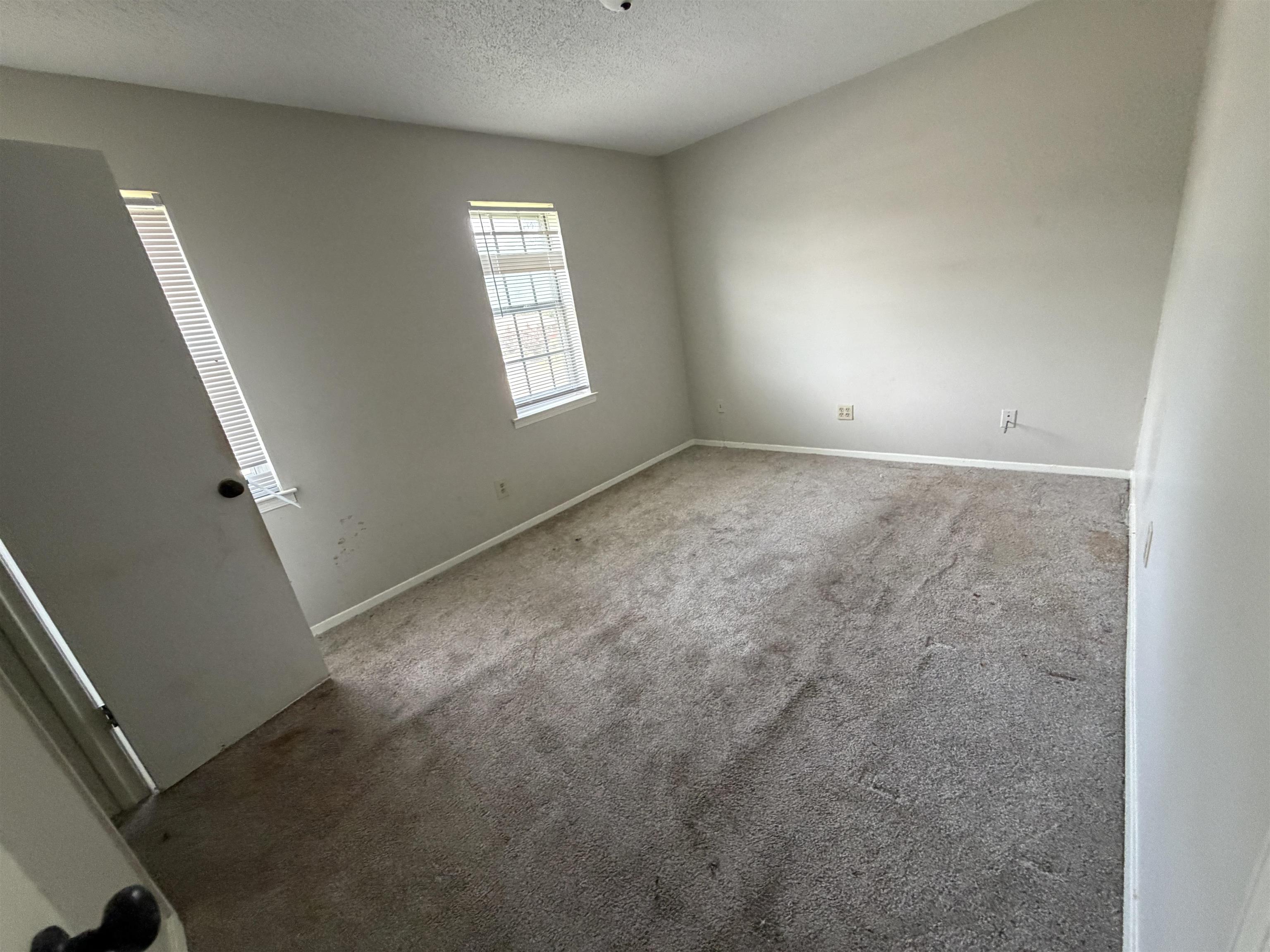 5573 Pleasant View Road, Unit 35 Memphis, TN 38134 - Photo 9 of 13 an empty room with windows