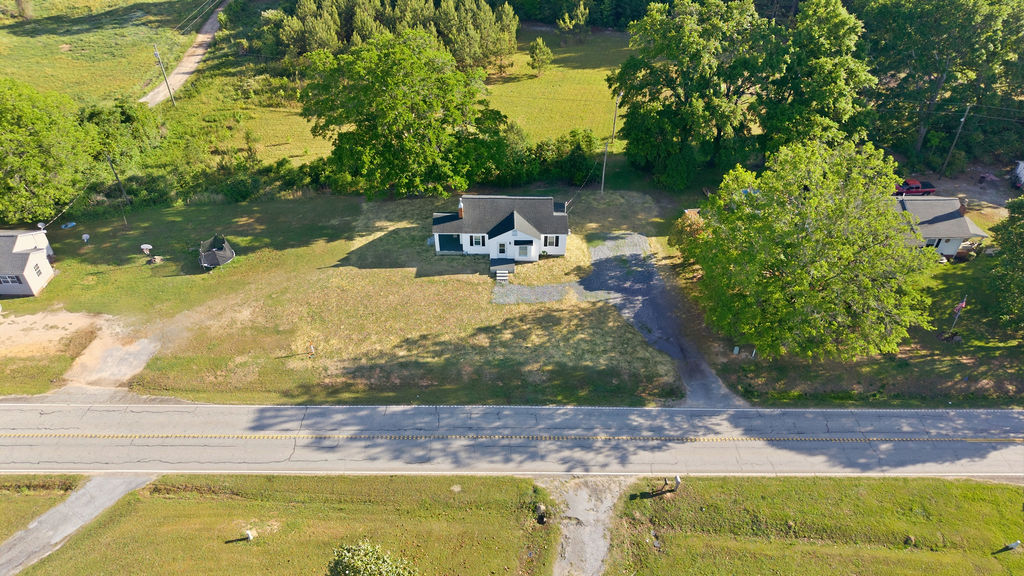 7604 Highway 252 Honea Path, SC 29654 - Photo 26 of 33 This aerial perspective showcases a charming residence nestled amidst expansive green surroundings.