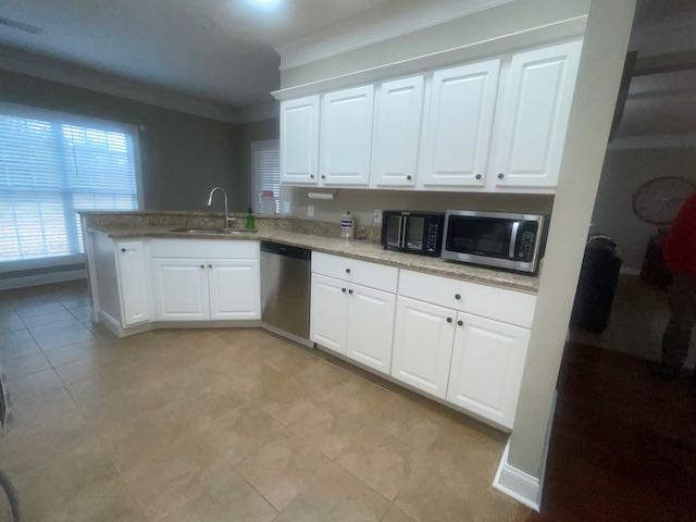 132 Newton Road LaGrange, GA 30240 - Photo 5 of 21 a kitchen with granite countertop white cabinets and white appliances