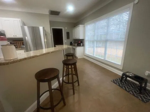 a room with gym equipment and a window