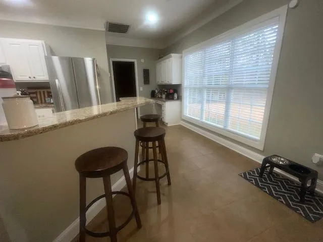 a room with gym equipment and a window