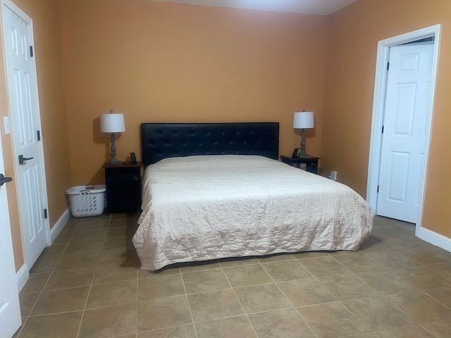 132 Newton Road LaGrange, GA 30240 - Photo 7 of 21 a bedroom with a bed and night stand