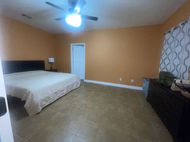 132 Newton Road LaGrange, GA 30240 - Photo 8 of 21 a bedroom with a bed and a lamp