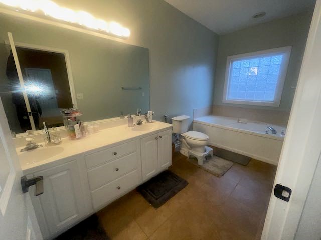 132 Newton Road LaGrange, GA 30240 - Photo 9 of 21 a bathroom with a double vanity sink a toilet and a mirror