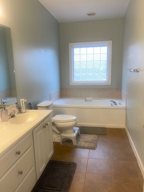 132 Newton Road LaGrange, GA 30240 - Photo 10 of 21 a spacious bathroom with a granite countertop toilet a sink and a bathtub
