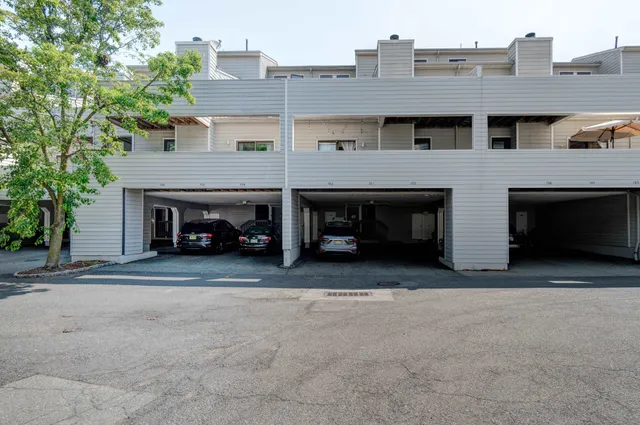 a view of a car parked in front of a building