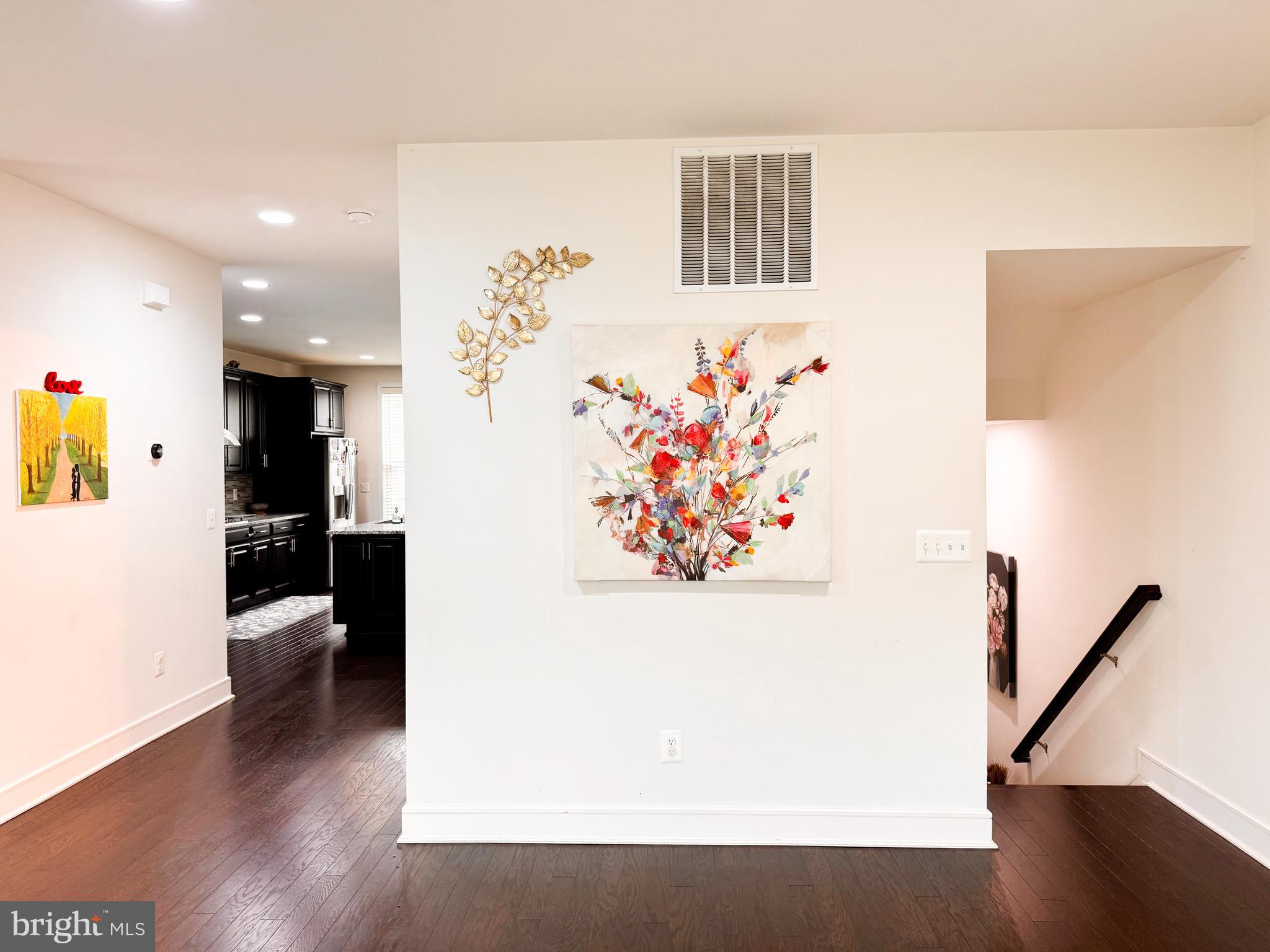 25419 Reed Orchard Terrace Chantilly, VA 20152 - Photo 16 of 47 a view of a hallway with wooden floor and stairs