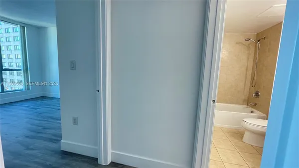 a bathroom with a glass shower door