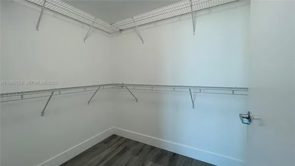 a view of a room with racks on the wall