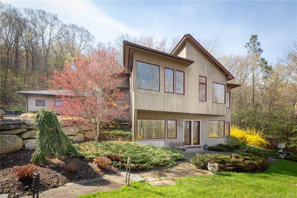 17 Woodin Road Kent, CT 06757 - Photo 1 of 1 a front view of a house with garden