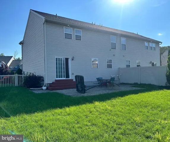 a backyard of a house with seating space