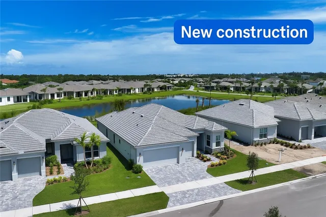 an aerial view of a house with a big yard