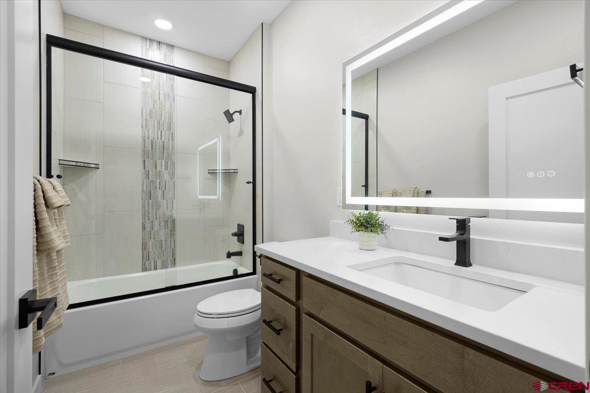 62774 Jacob Road Montrose, CO 81401 - Photo 29 of 35 a bathroom with a sink a toilet and shower