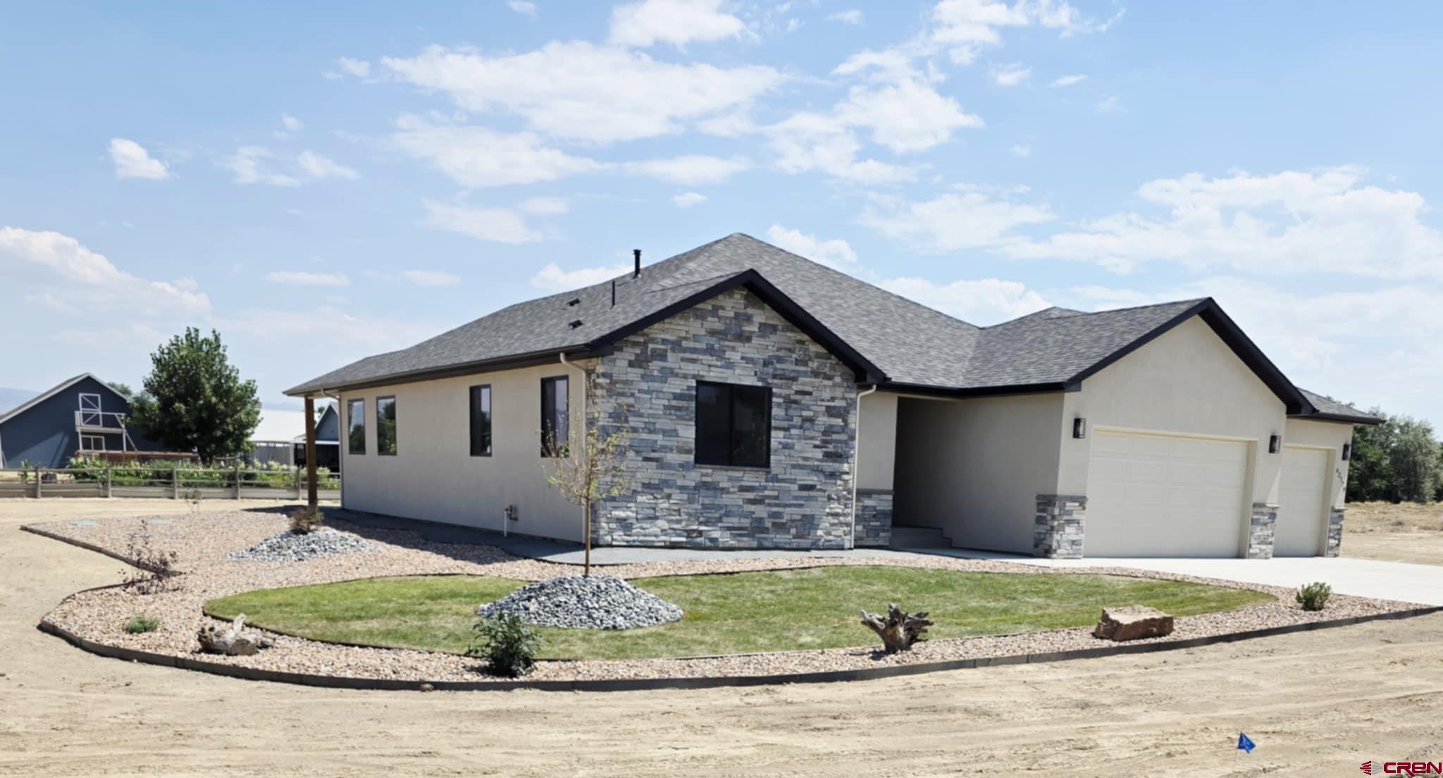 62774 Jacob Road Montrose, CO 81401 - Photo 3 of 35 a front view of house with garage