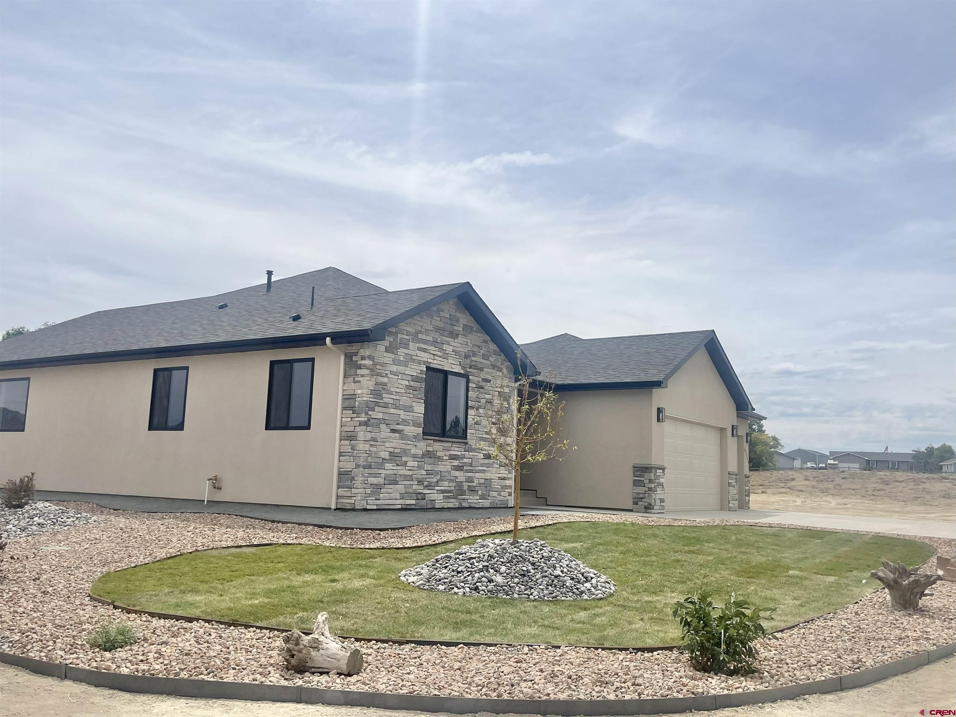 62774 Jacob Road Montrose, CO 81401 - Photo 4 of 35 a view of a house with a yard