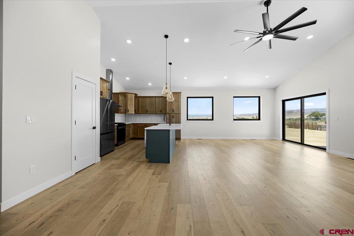 62774 Jacob Road Montrose, CO 81401 - Photo 7 of 35 a view of empty room with wooden floor and window