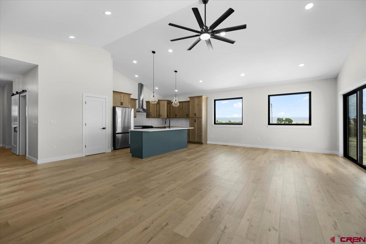 62774 Jacob Road Montrose, CO 81401 - Photo 8 of 35 a view of a kitchen with a sink and a refrigerator