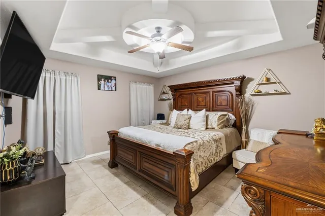 a bed room with a bed and a chandelier