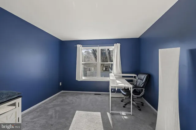 a workspace with furniture and a window