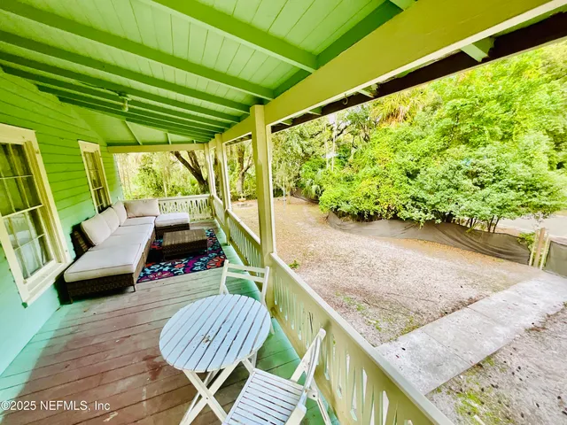 a bathroom with a sink mirror and vanity