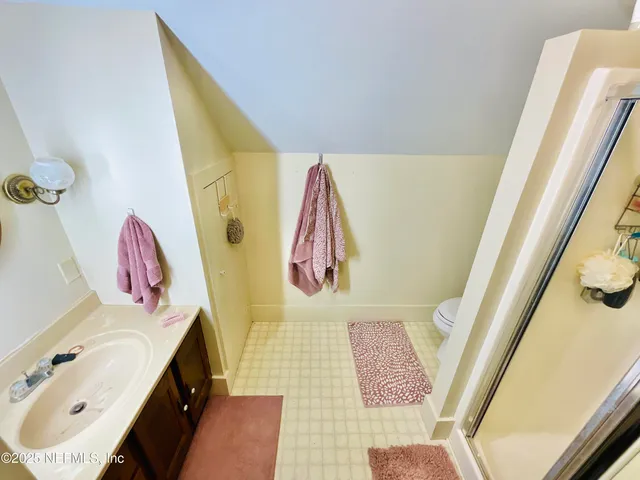 a view of a house with a yard and garage