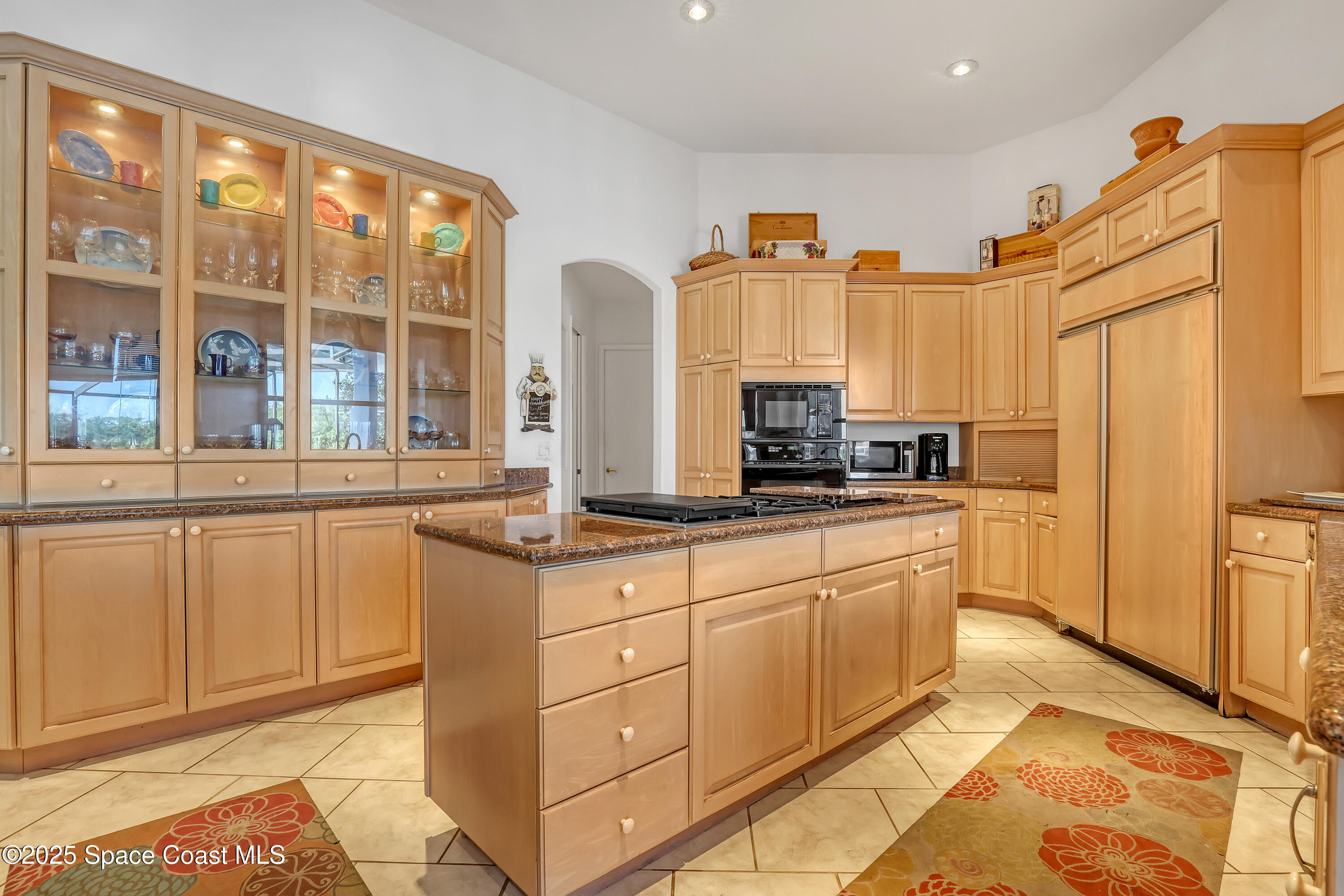813 Hogan Way Melbourne, FL 32940 - Photo 12 of 50 a kitchen with stainless steel appliances granite countertop a stove a sink and a refrigerator