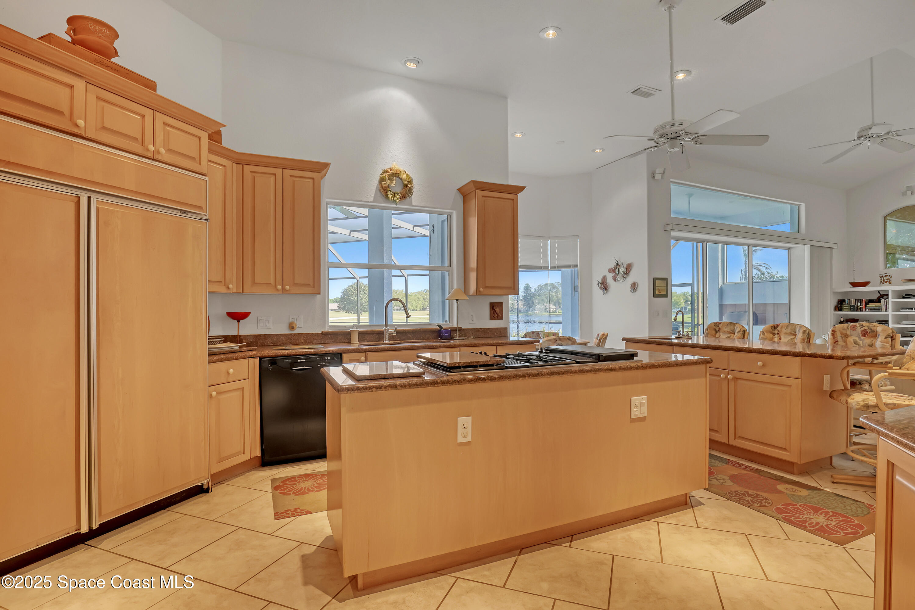 813 Hogan Way Melbourne, FL 32940 - Photo 13 of 50 a kitchen with stainless steel appliances granite countertop a stove a sink dishwasher and a refrigerator