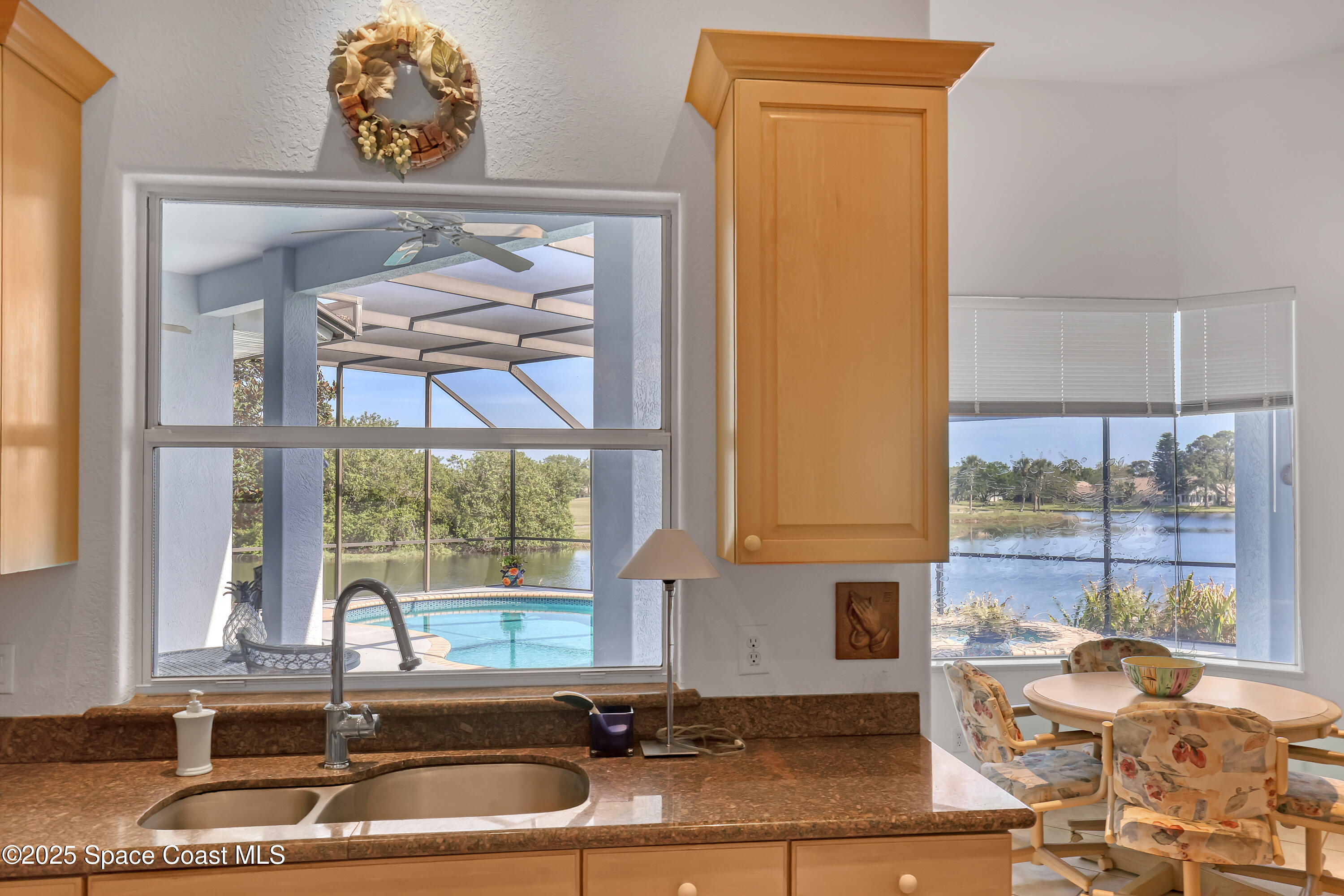 813 Hogan Way Melbourne, FL 32940 - Photo 14 of 50 a kitchen with a sink and a window