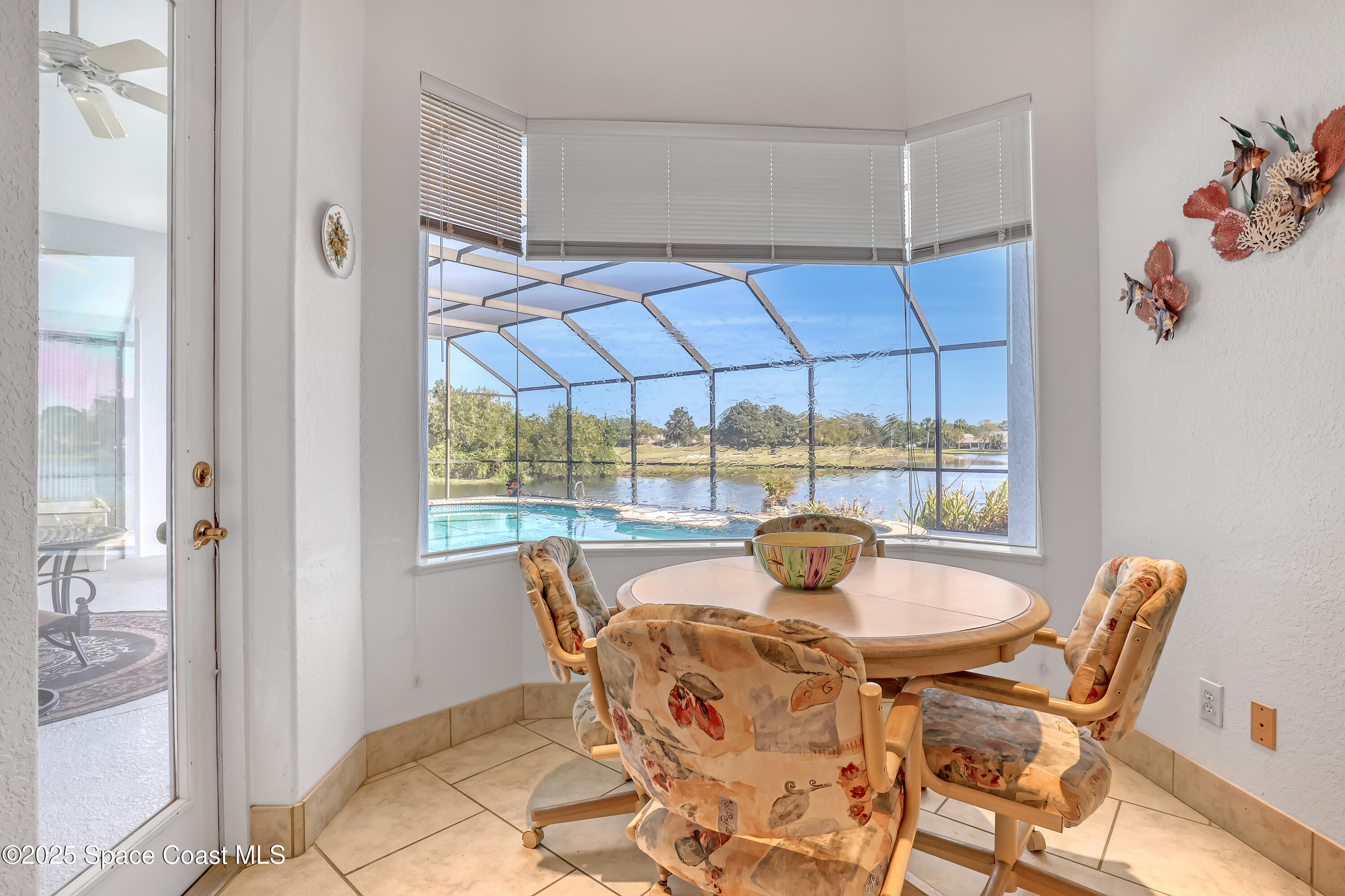 813 Hogan Way Melbourne, FL 32940 - Photo 17 of 50 a view of a dining room with furniture window and outside view