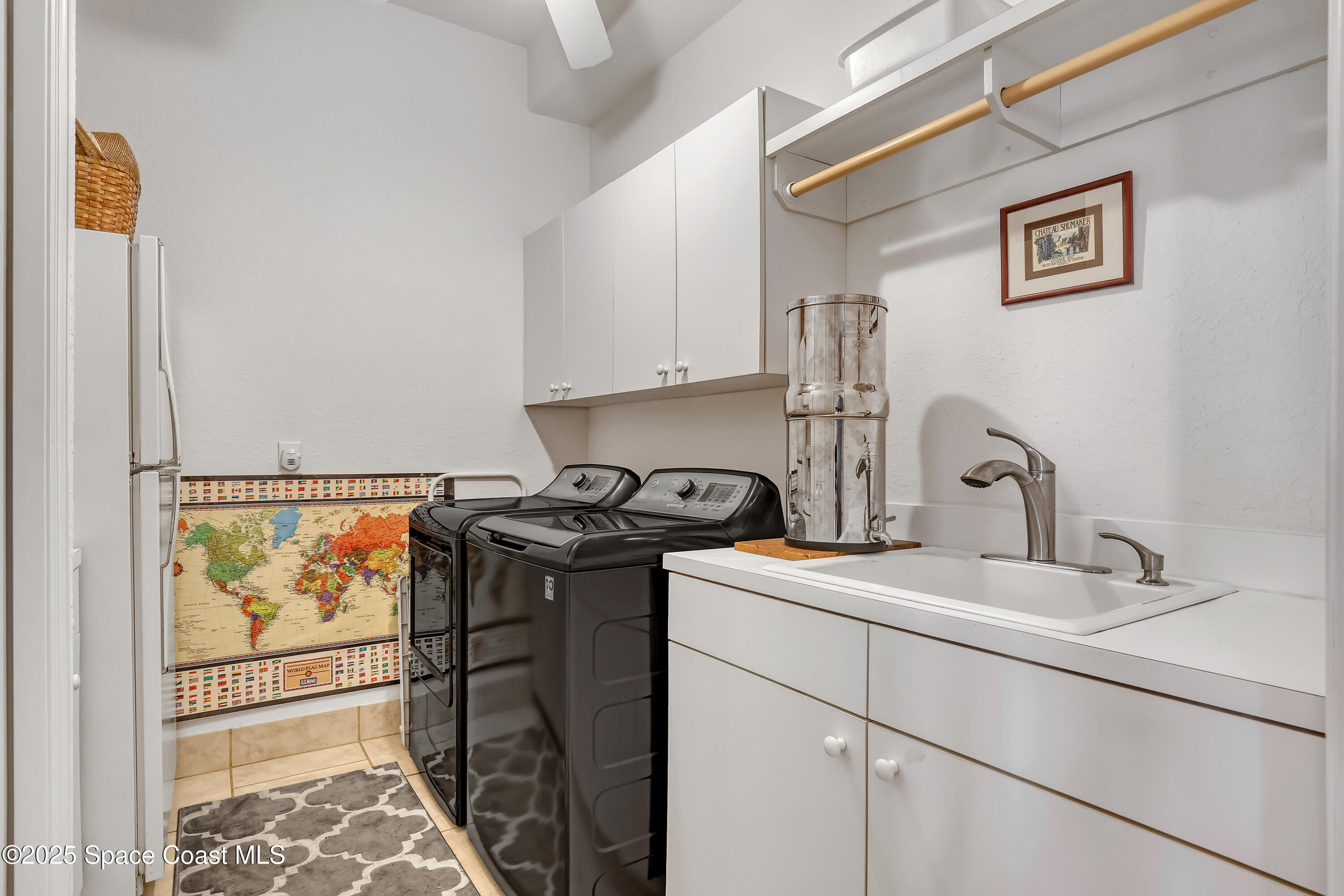813 Hogan Way Melbourne, FL 32940 - Photo 20 of 50 a view of a sink and dishwasher with wooden floor