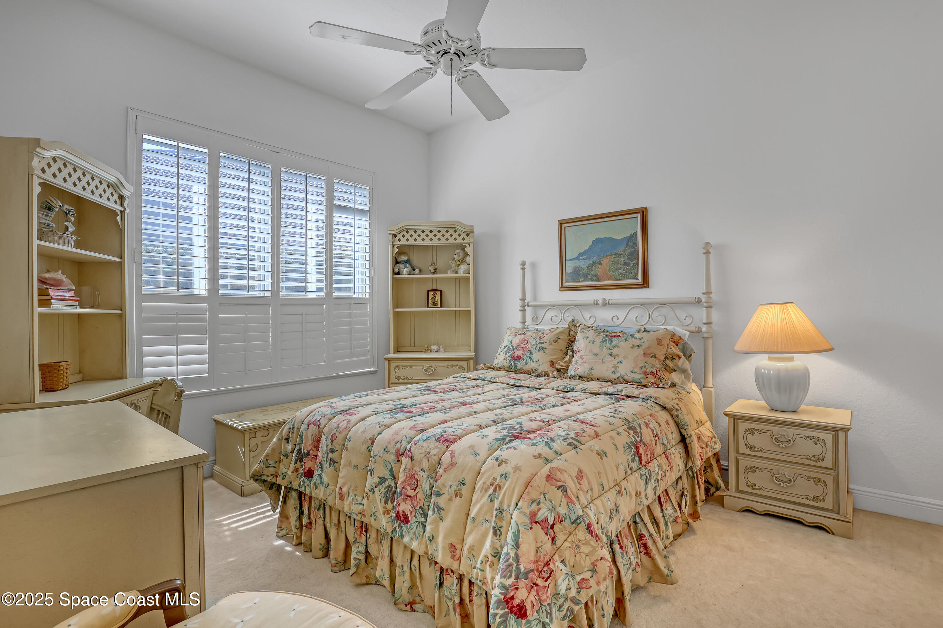 813 Hogan Way Melbourne, FL 32940 - Photo 24 of 50 a bedroom with a bed and a chandelier