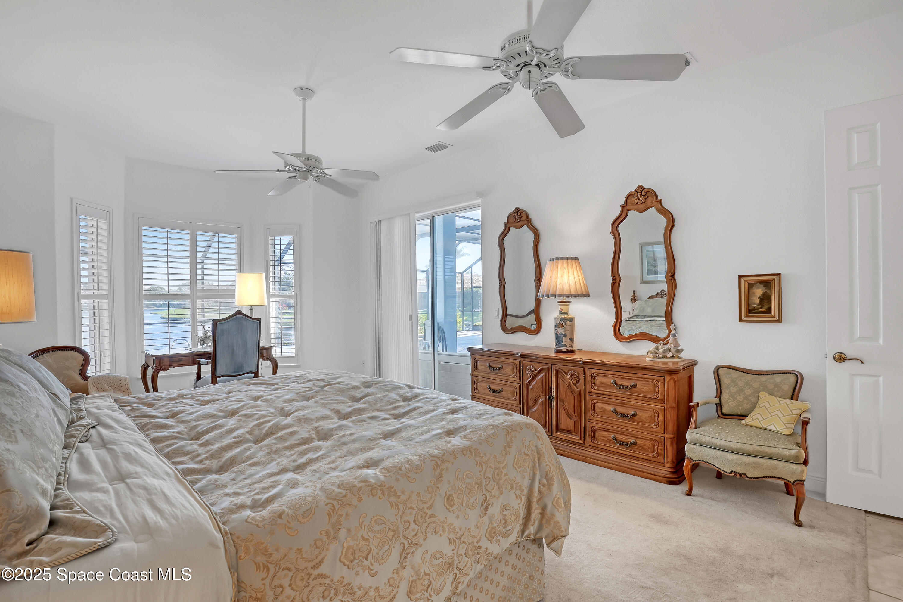 813 Hogan Way Melbourne, FL 32940 - Photo 29 of 50 a bedroom with a bed couch and window