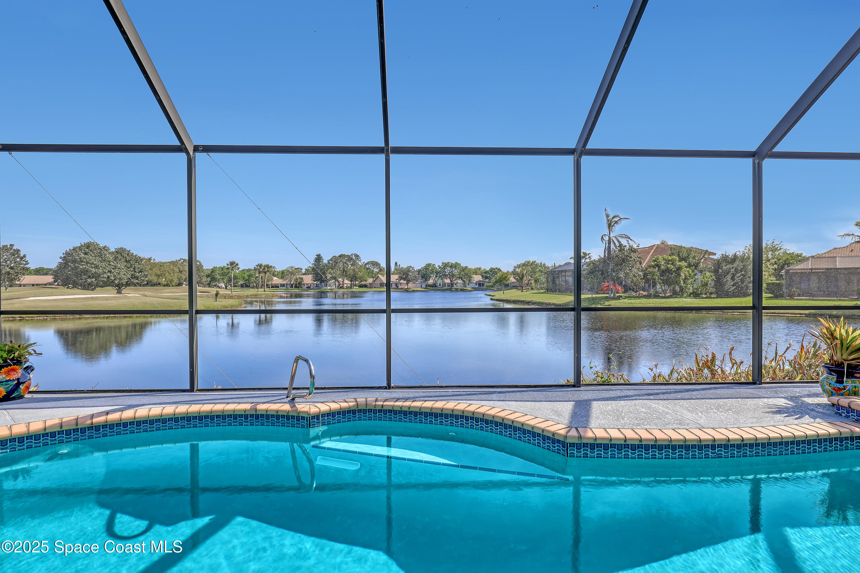 813 Hogan Way Melbourne, FL 32940 - Photo 3 of 50 a view of a lake from a balcony