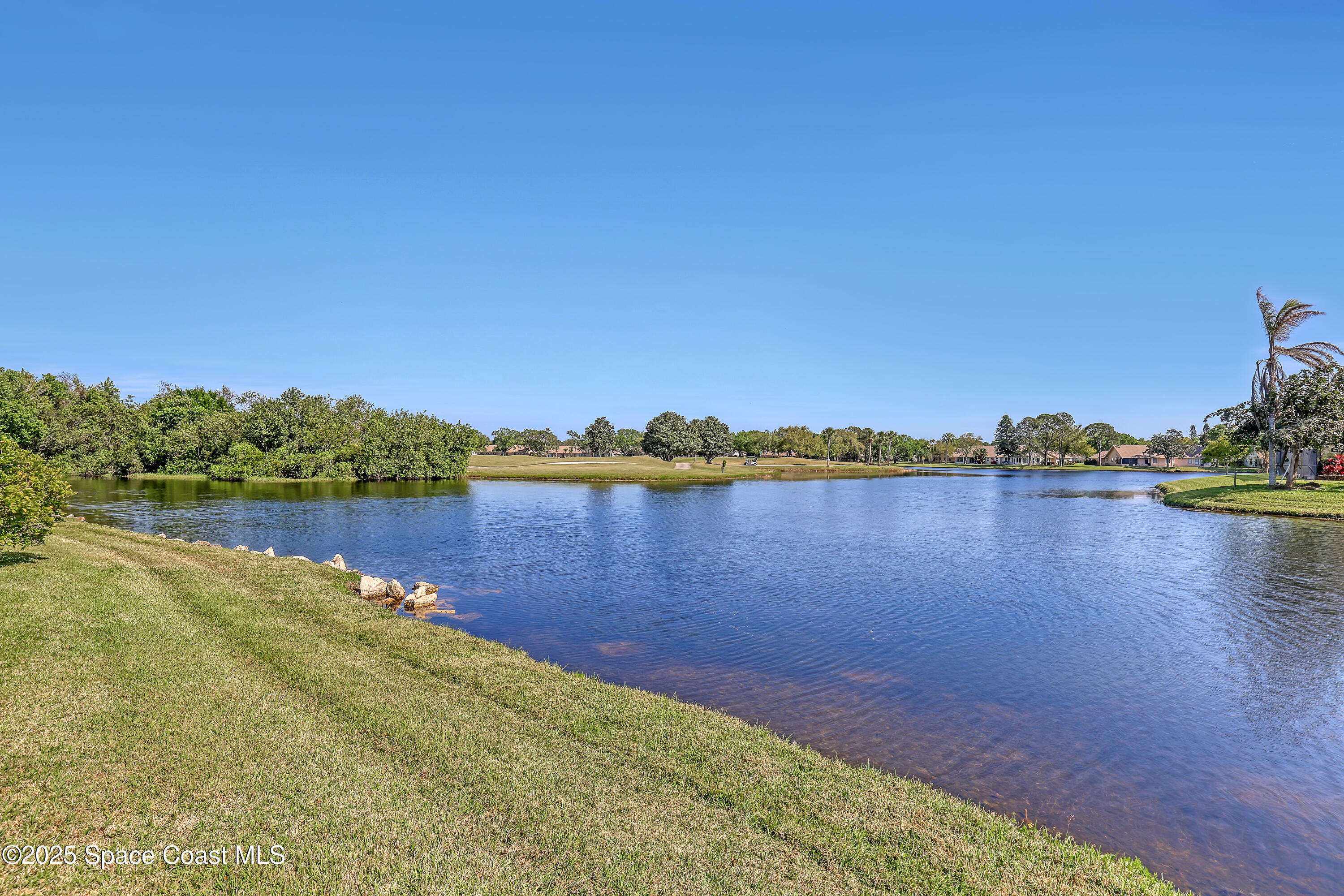 813 Hogan Way Melbourne, FL 32940 - Photo 38 of 50 a view of a lake with a city view