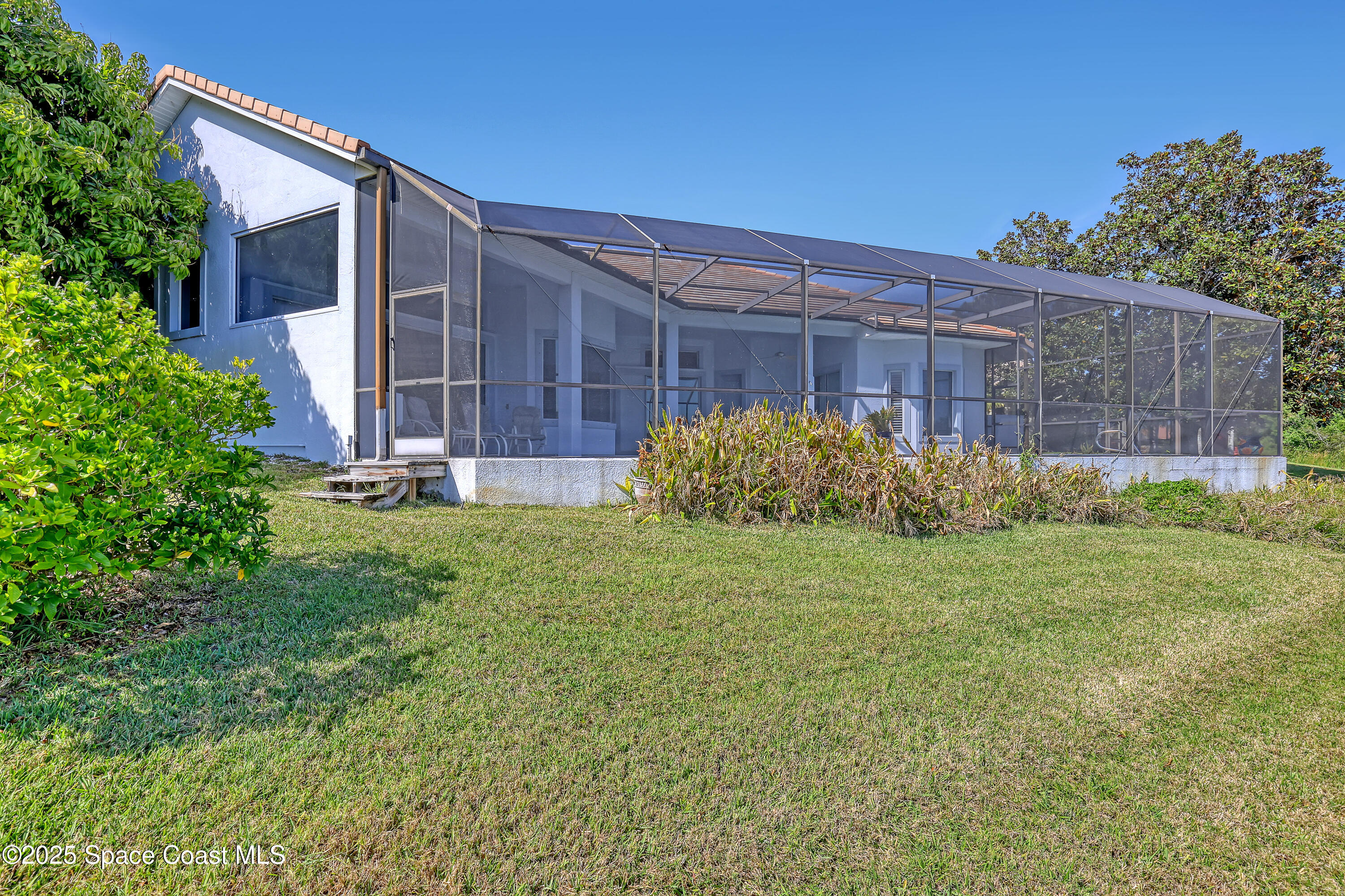 813 Hogan Way Melbourne, FL 32940 - Photo 39 of 50 a view of a back yard of the house