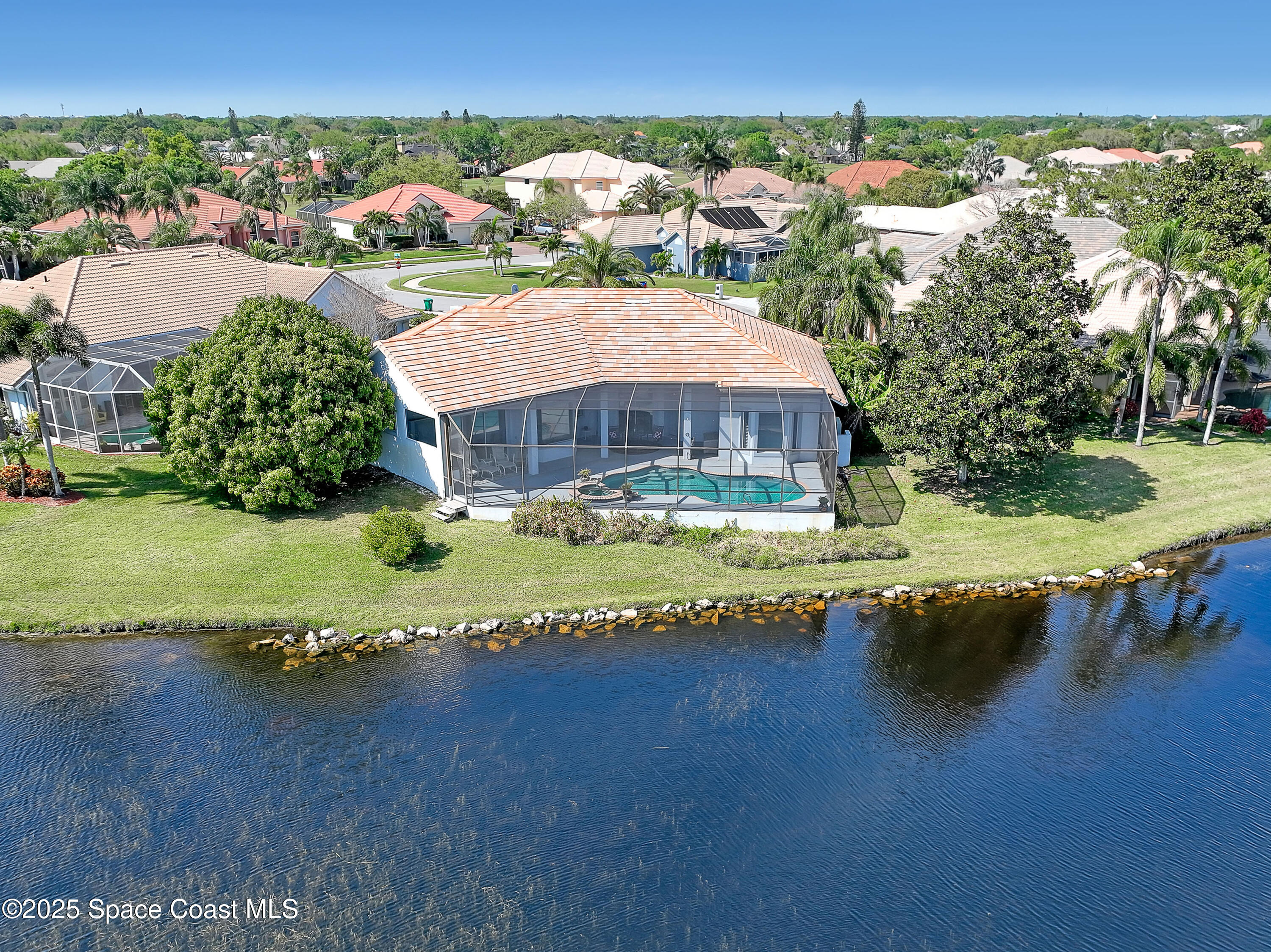 813 Hogan Way Melbourne, FL 32940 - Photo 43 of 50 an aerial view of residential houses with outdoor space and swimming pool
