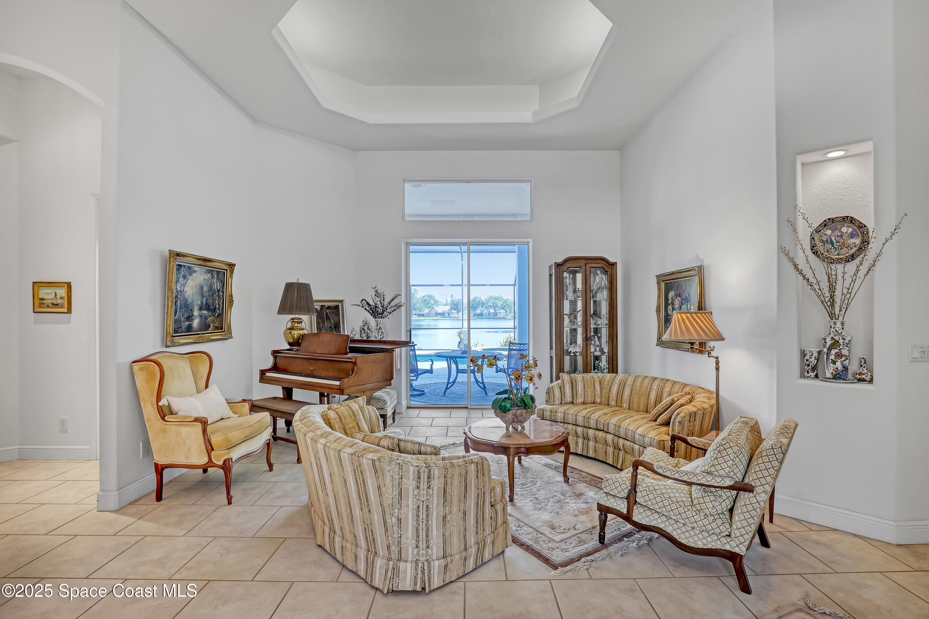 813 Hogan Way Melbourne, FL 32940 - Photo 6 of 50 a living room with furniture and two windows