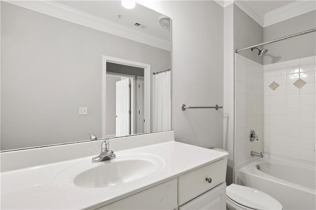 4102 Westchester Ridge Northeast Brookhaven, GA 30329 - Photo 13 of 35 a bathroom with a sink toilet vanity and shower
