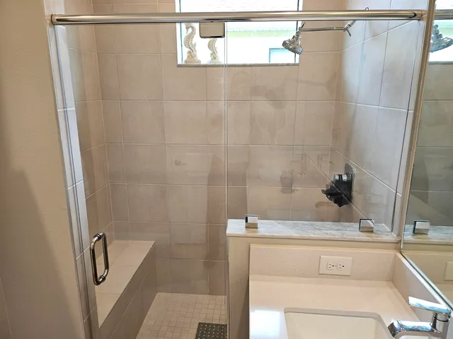 a bathroom with a sink and a shower