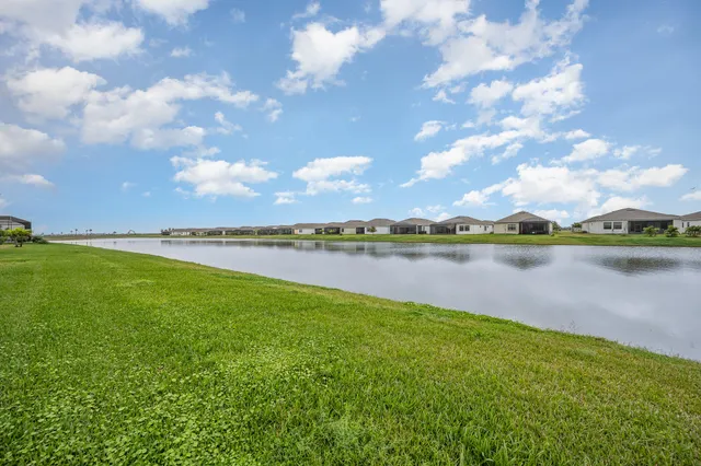 a view of a lake with houses in the back