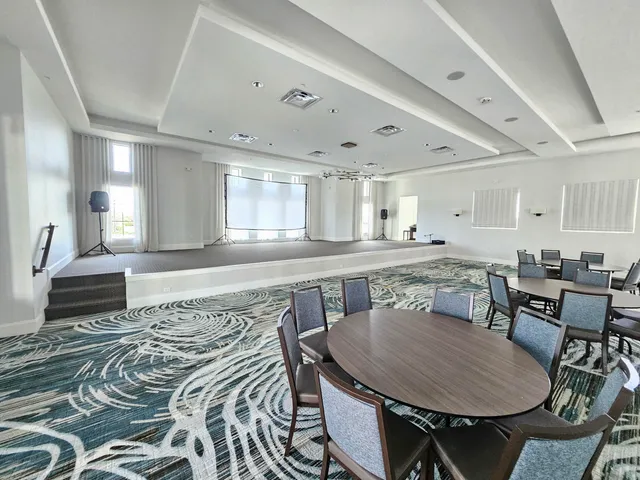 a dining room with a table and chairs