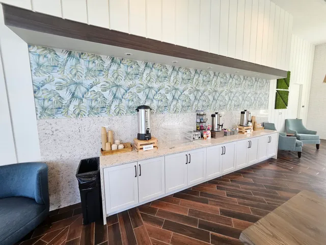 a kitchen with stainless steel appliances a sink and a refrigerator