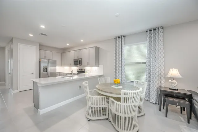 a kitchen with a sink cabinets and window