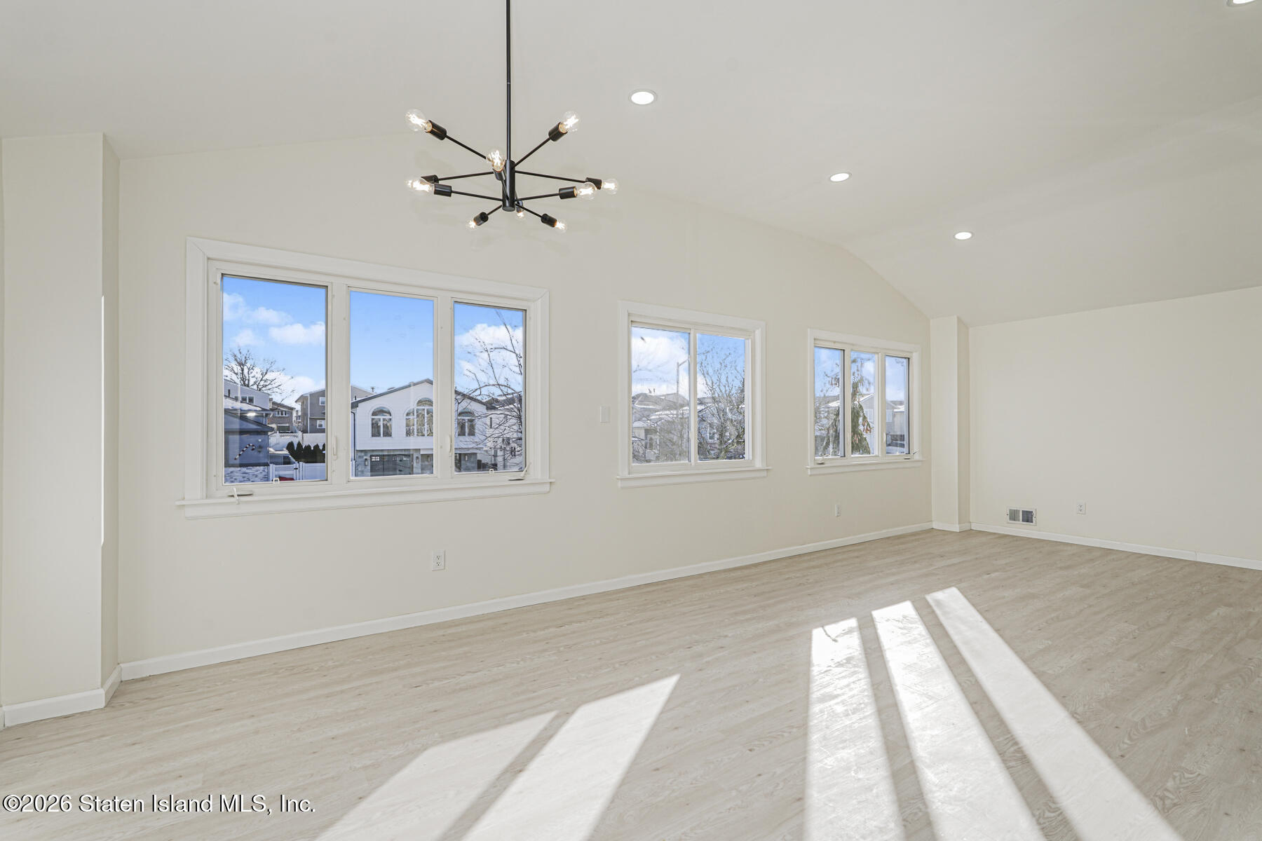 39 Commerce Street Staten Island, NY 10314 - Photo 11 of 49 a view of an empty room with a window