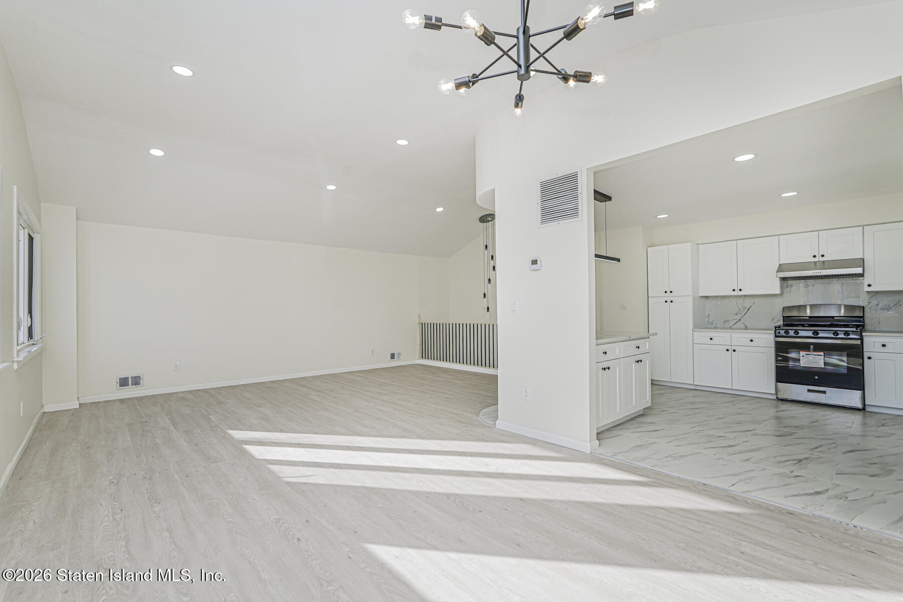 39 Commerce Street Staten Island, NY 10314 - Photo 13 of 49 a view of kitchen with stainless steel appliances a refrigerator and cabinets
